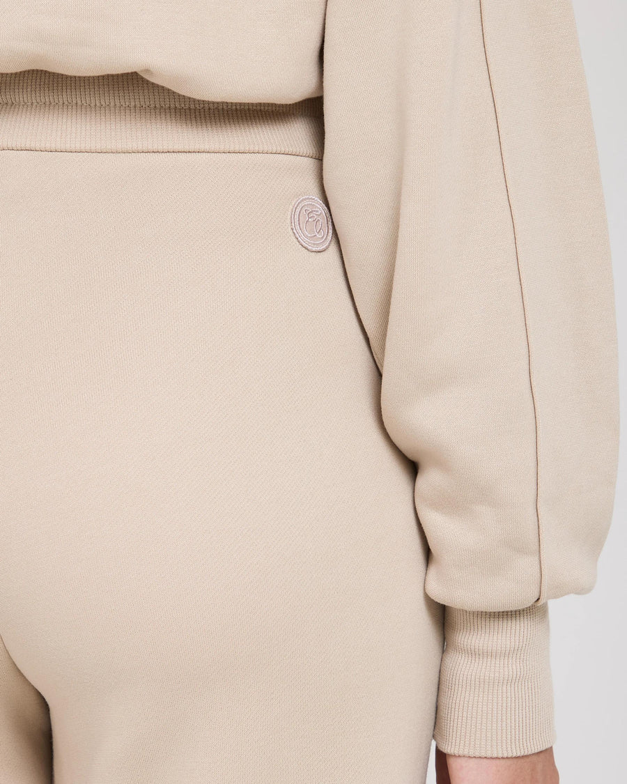 Mello Lyocell Fleece Wide Leg Pants in Beige with gold accent detail