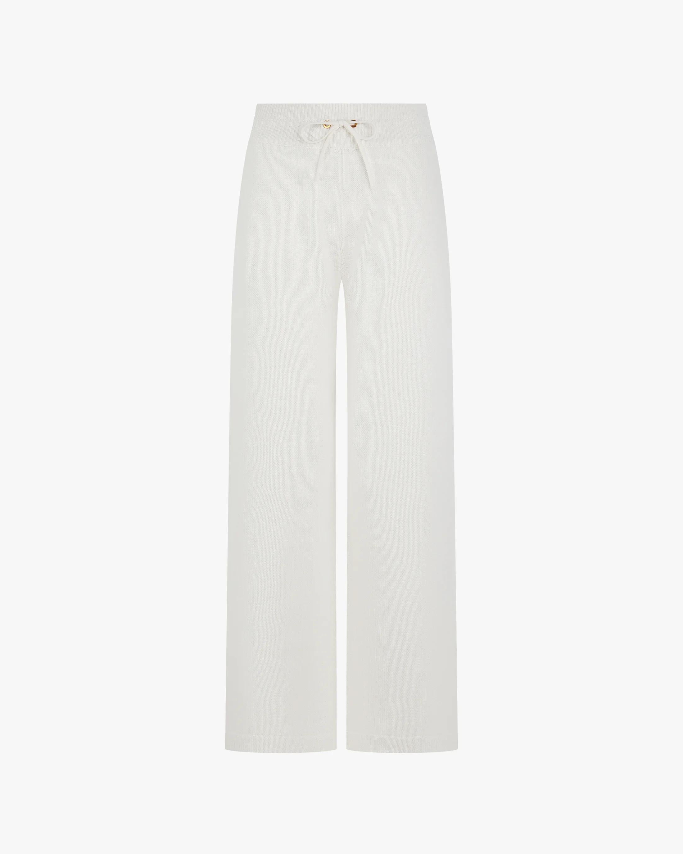 Wide leg trousers in a cream hue with a merino wool and cashmere blend, featuring gold hardware and a relaxed fit.