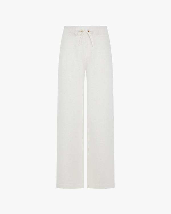 Wide leg trousers in a cream hue with a merino wool and cashmere blend, featuring gold hardware and a relaxed fit.