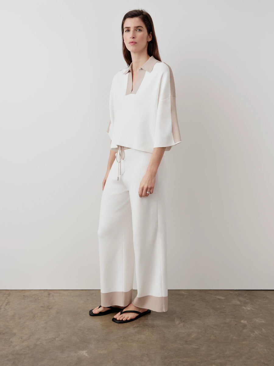 Contrast Hem Wide Leg Trouser in white with soft wide-leg silhouette and structured waist, styled with matching polo top.