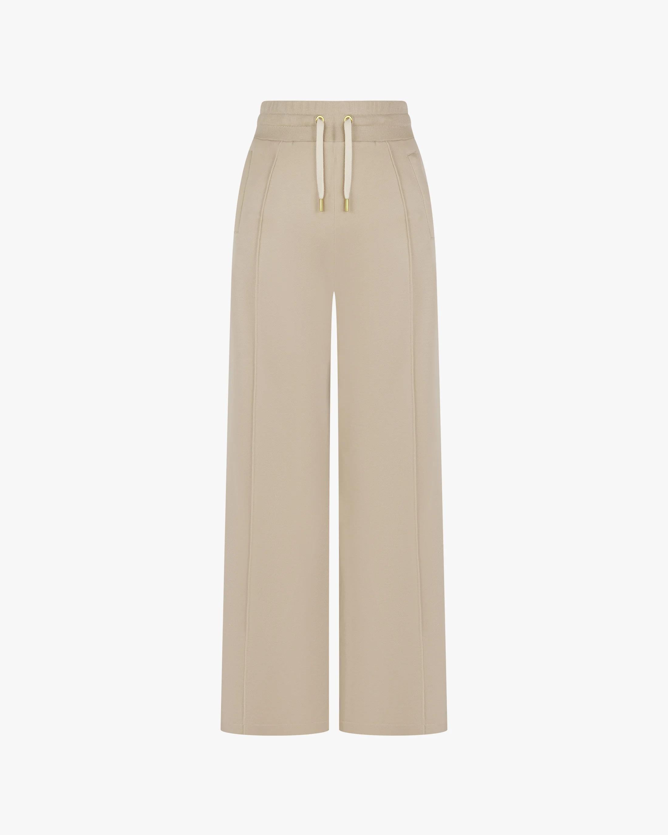 Beige wide-leg Lyocell trousers with gold-finish accents and double-layer drawcord waistband, front view.