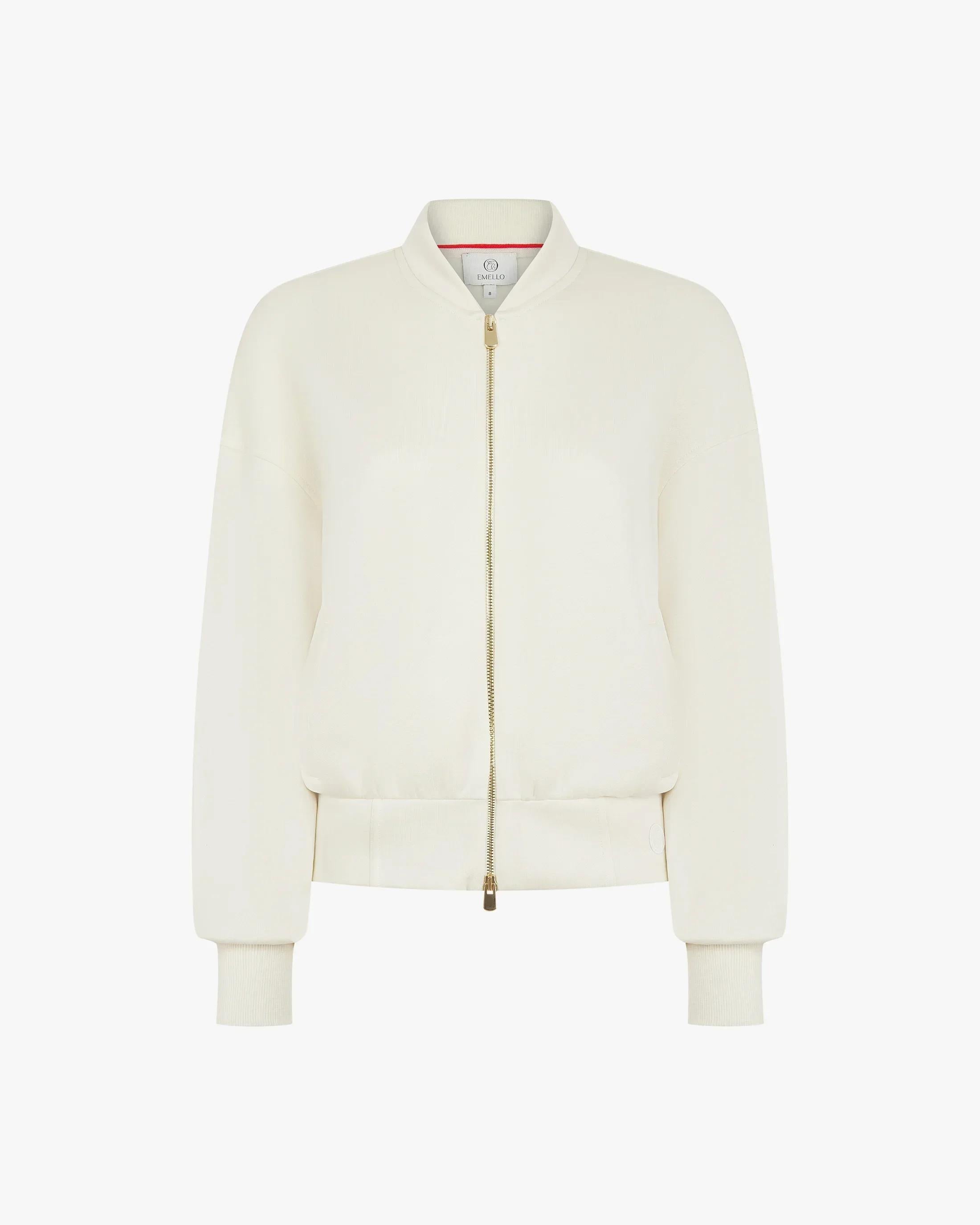 Cream zip-through jacket in buttery-soft lyocell fleece with gold hardware.